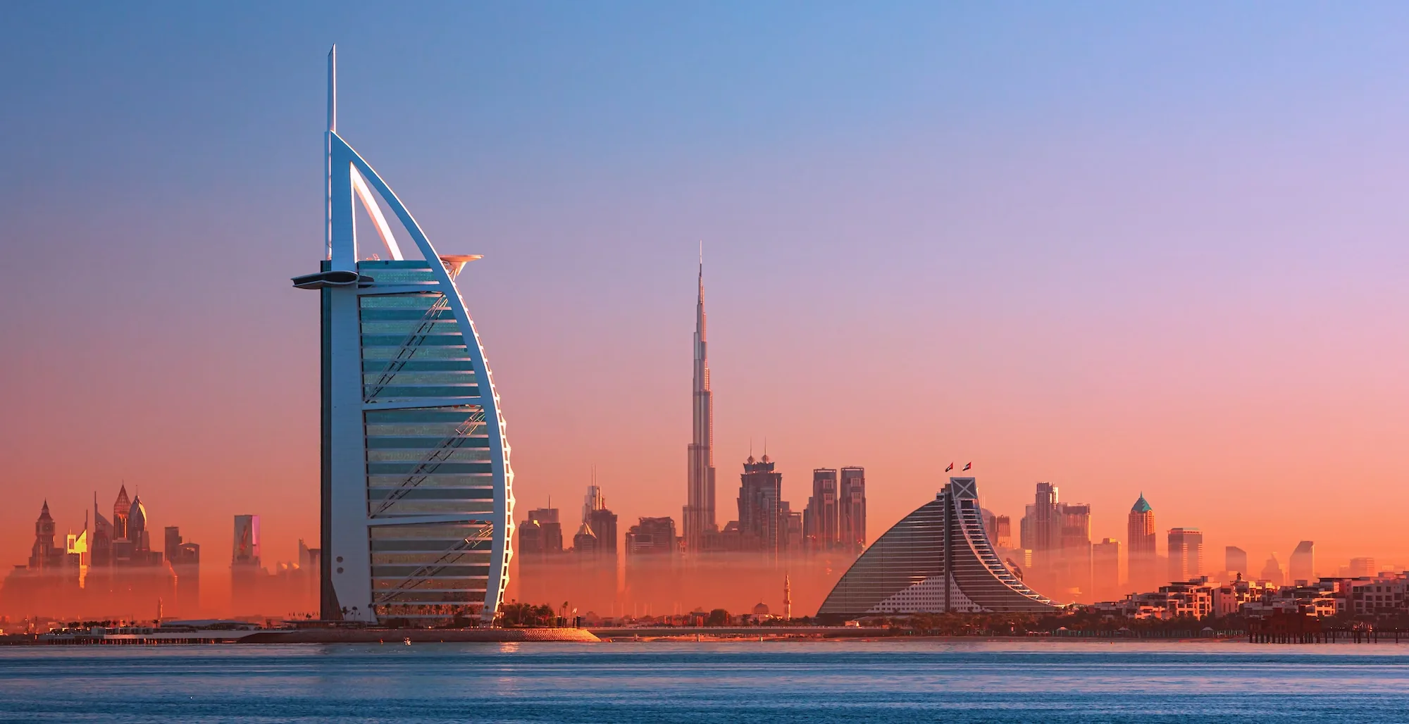 The Burj Al Arab and the Burj Khalifa on the Dubai skyline at sunrise